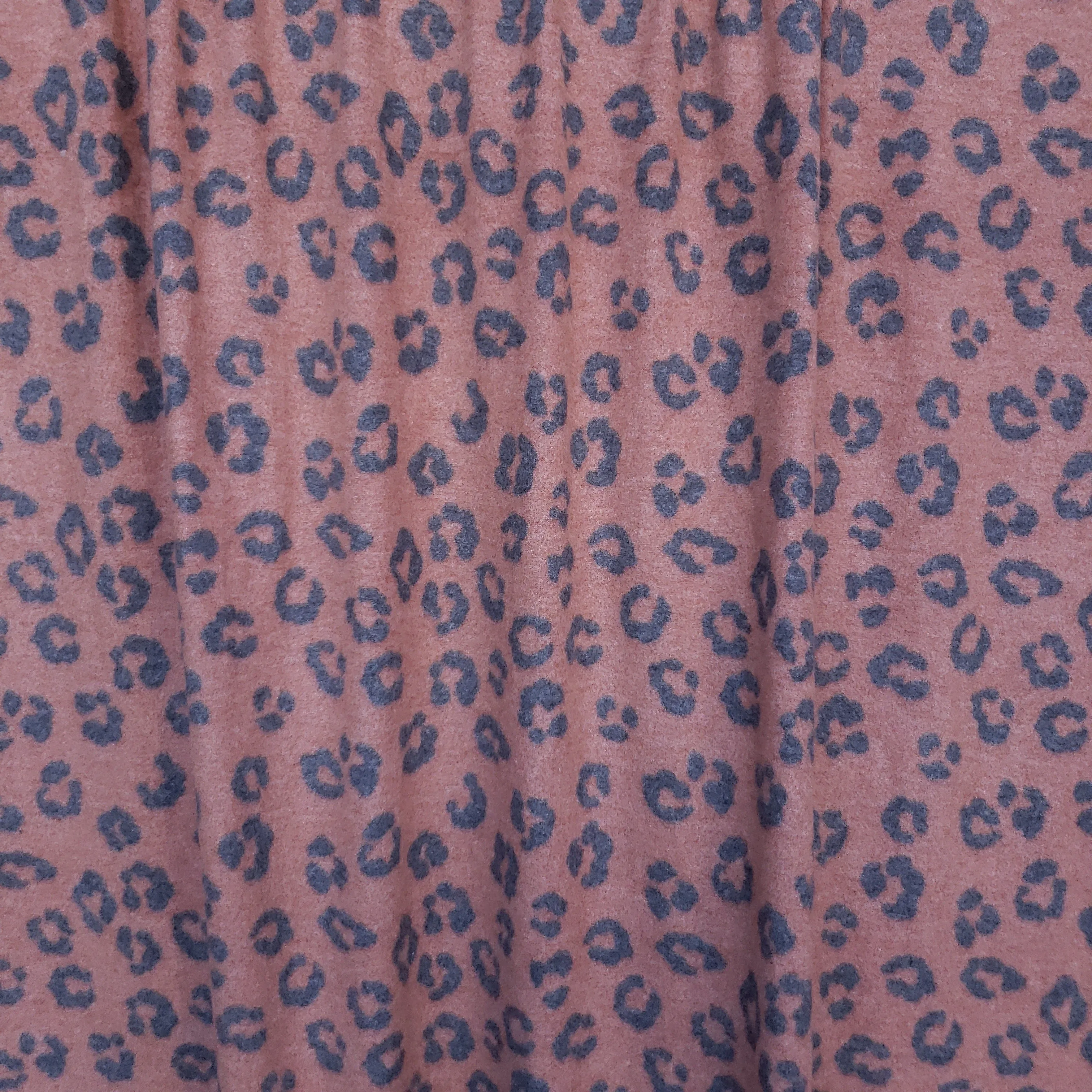 *Rust Animal Print Brushed Sweater Knit Poly Spandex. Last Yards - May not be continuous.
